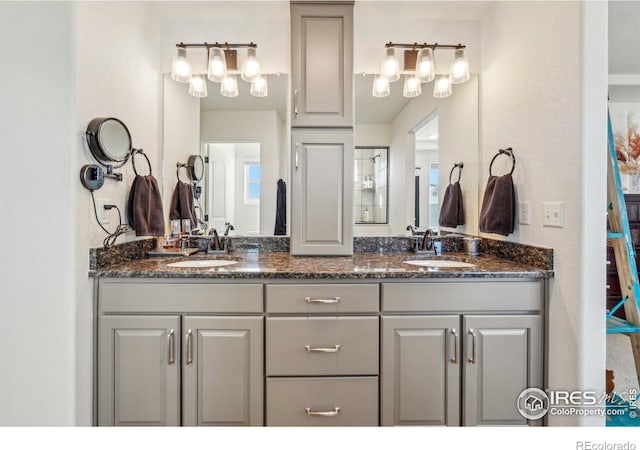 bathroom with double vanity and a sink