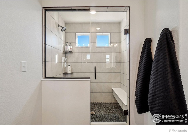 bathroom featuring a stall shower