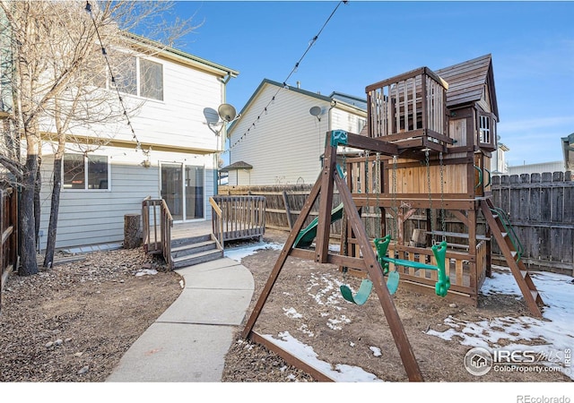 view of jungle gym featuring a deck