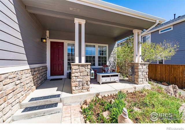 doorway to property with a porch