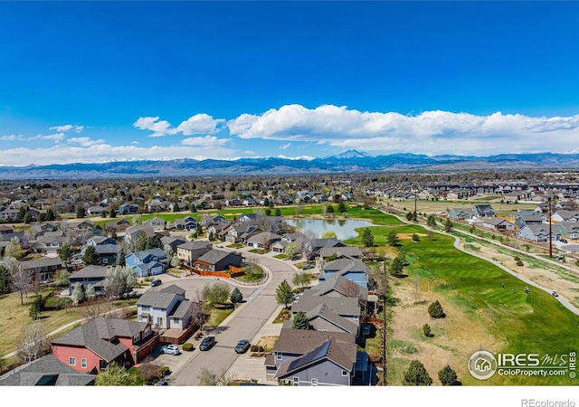 birds eye view of property featuring a water and mountain view