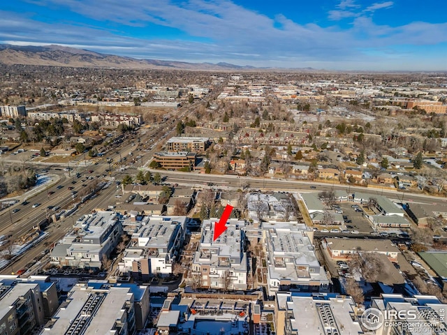 birds eye view of property featuring a mountain view