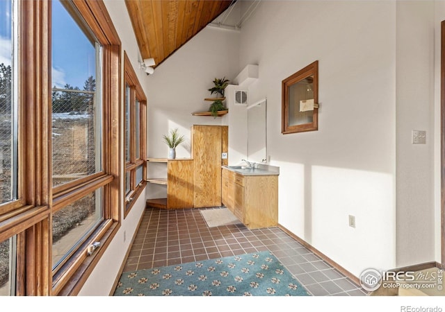 interior space with wooden ceiling and sink