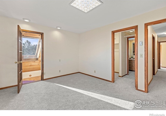 unfurnished bedroom featuring light colored carpet