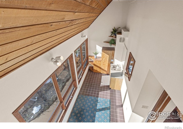 stairs with wooden ceiling