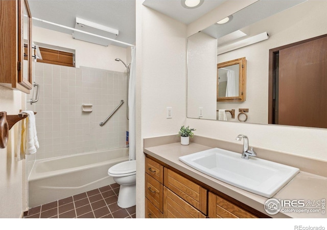 full bathroom with toilet, tile patterned flooring, tiled shower / bath combo, and vanity