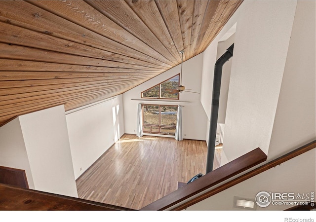 staircase with wood-type flooring, lofted ceiling, and wood ceiling