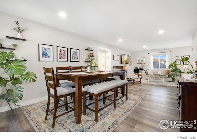 dining area with hardwood / wood-style floors