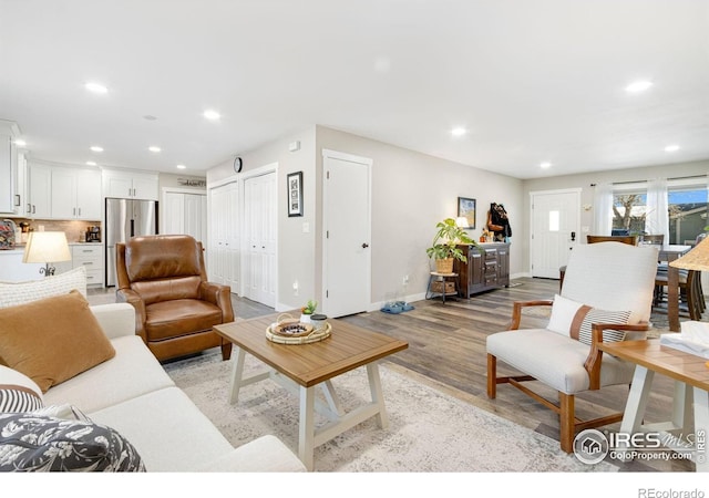 living room with light hardwood / wood-style floors