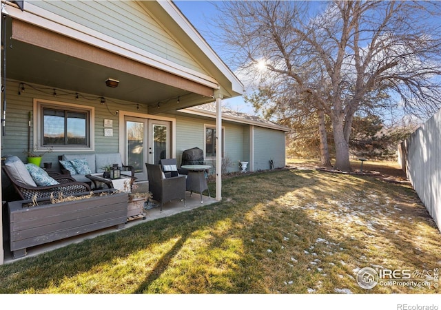 view of yard featuring outdoor lounge area, french doors, and a patio