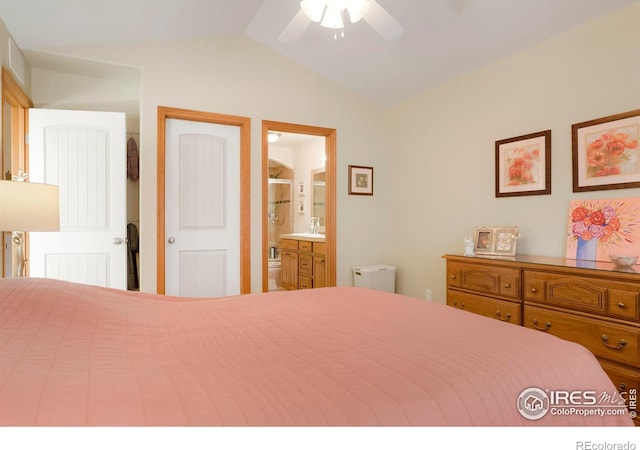 bedroom featuring ensuite bath, vaulted ceiling, and ceiling fan