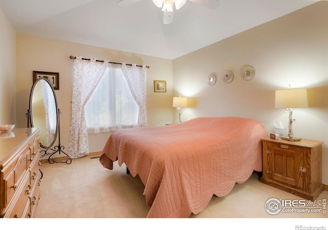 bedroom featuring ceiling fan and light colored carpet