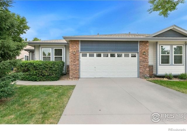 ranch-style home with a garage and a front yard