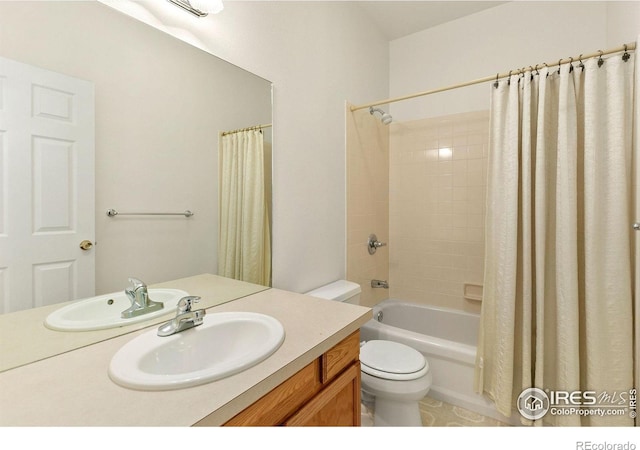 full bathroom with toilet, shower / tub combo, and vanity