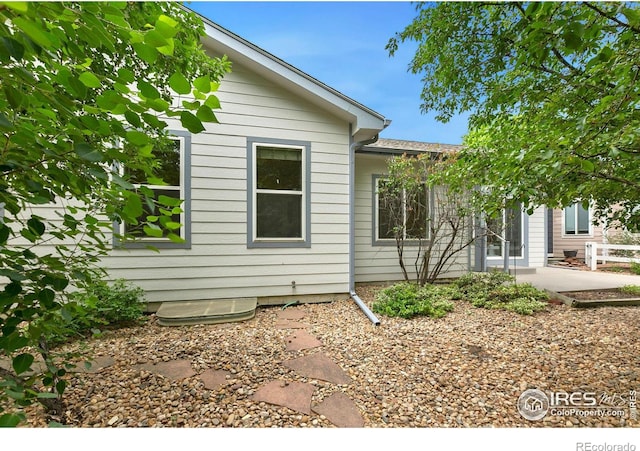 view of property exterior with a patio