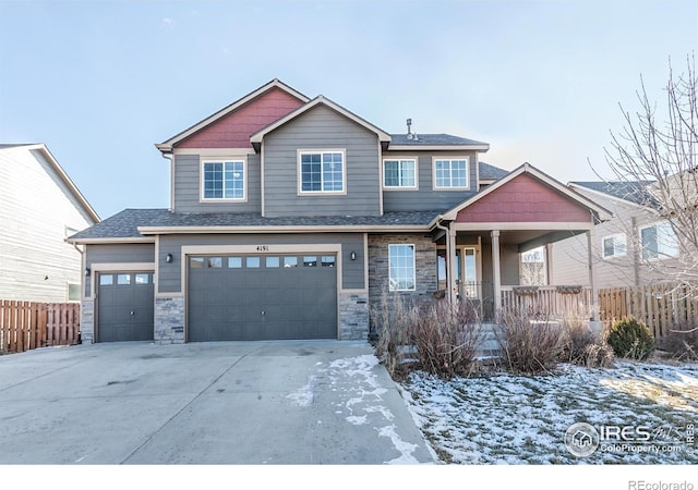 craftsman house featuring covered porch and a garage