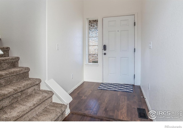 foyer featuring dark hardwood / wood-style floors