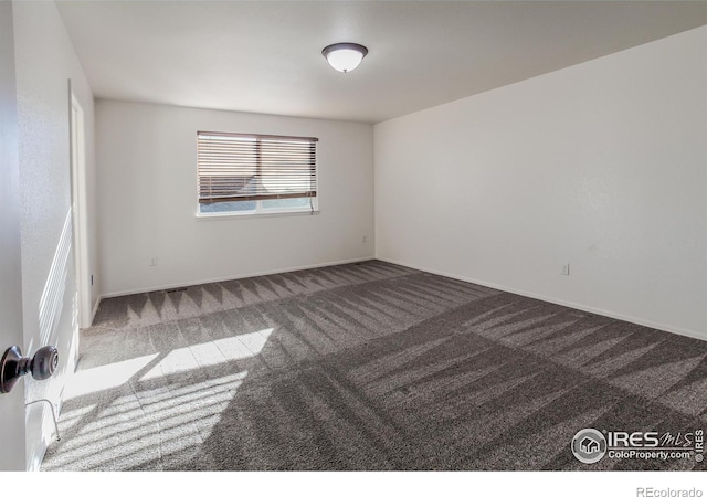 empty room featuring carpet floors