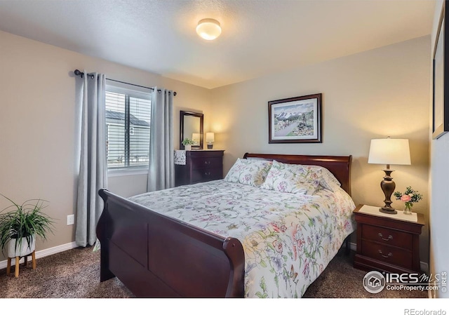 bedroom featuring dark colored carpet