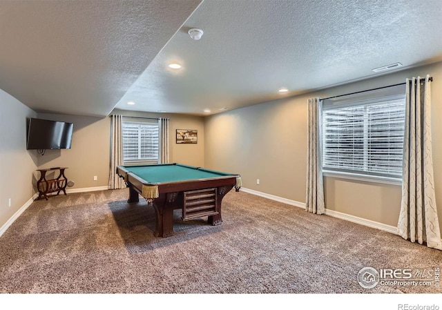 game room featuring pool table, carpet flooring, and a textured ceiling