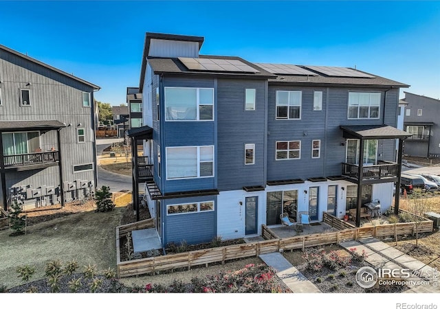 view of front of home featuring solar panels