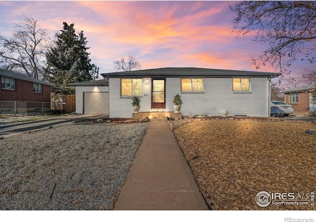 view of front of property featuring a garage