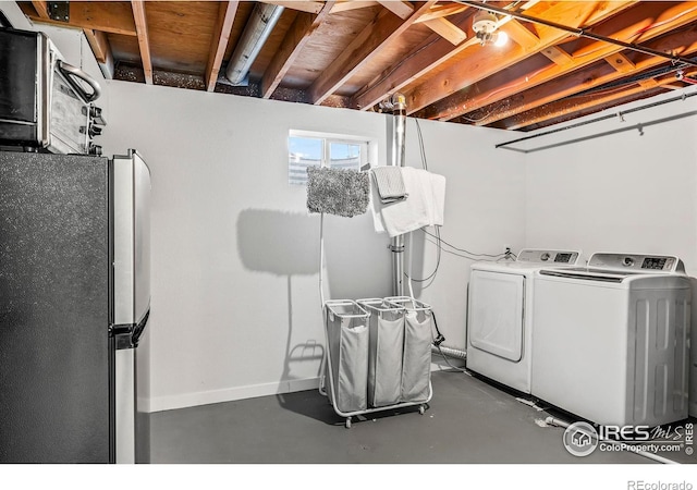 clothes washing area featuring washing machine and dryer