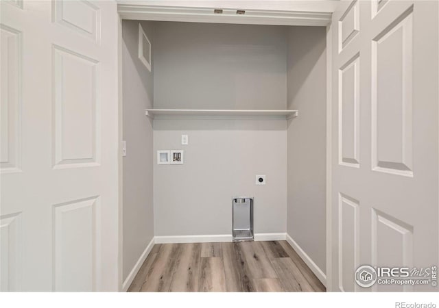 laundry area featuring light wood-type flooring, hookup for a washing machine, and hookup for an electric dryer