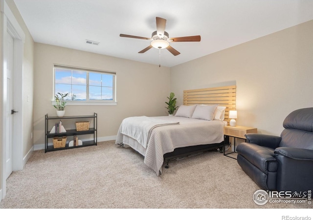 bedroom featuring light carpet and ceiling fan