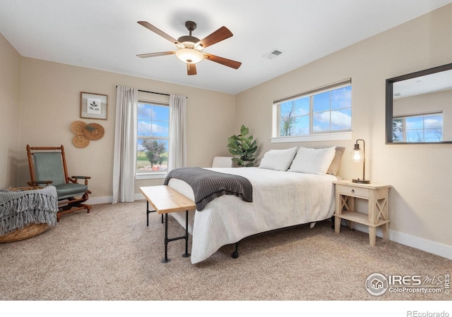 carpeted bedroom with ceiling fan