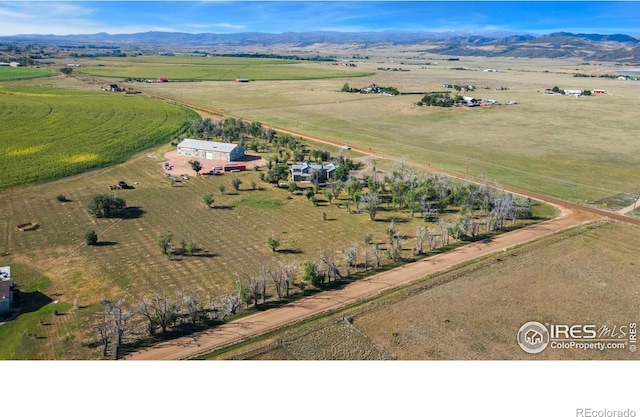 aerial view featuring a rural view and a mountain view