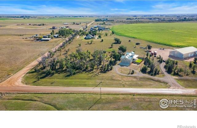 birds eye view of property with a rural view