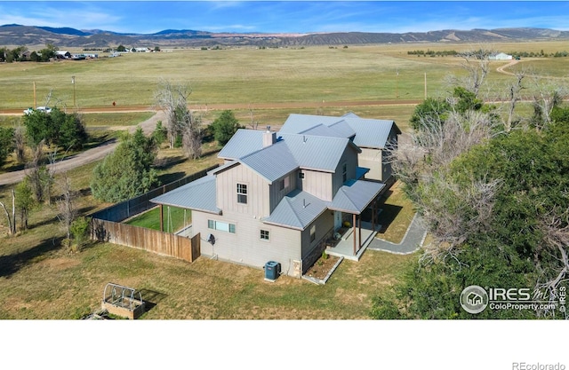 drone / aerial view featuring a rural view and a mountain view