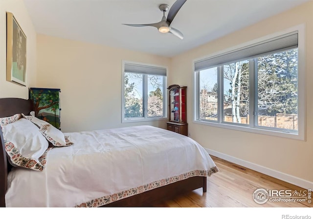 bedroom featuring ceiling fan and light hardwood / wood-style floors