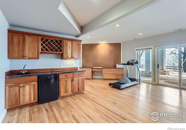 kitchen with sink, fridge, light hardwood / wood-style floors, and black dishwasher