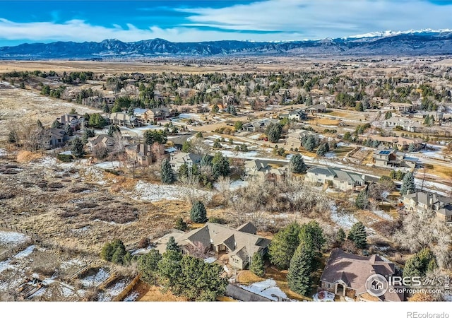 birds eye view of property featuring a mountain view