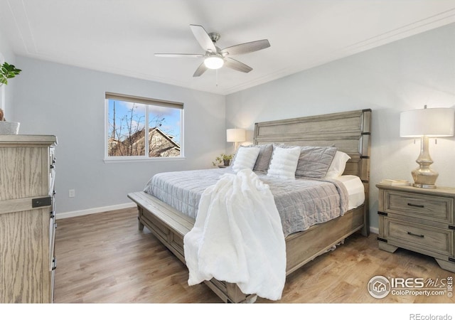 bedroom featuring ceiling fan and light hardwood / wood-style floors