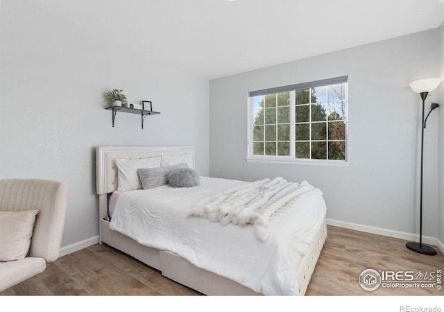 bedroom featuring hardwood / wood-style floors