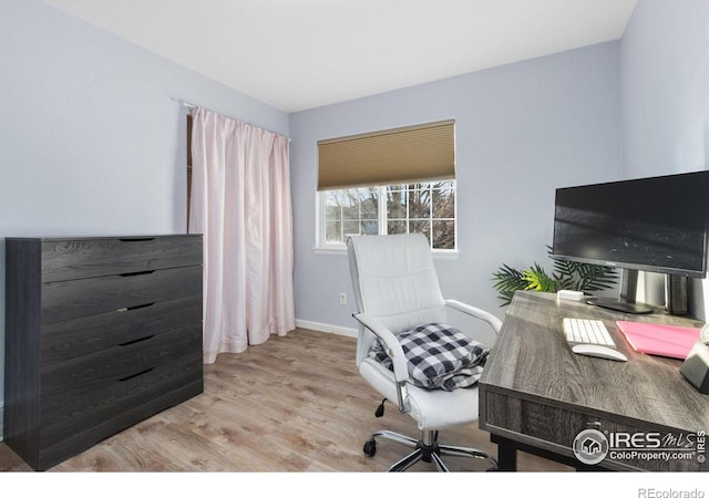 office space with light wood-type flooring