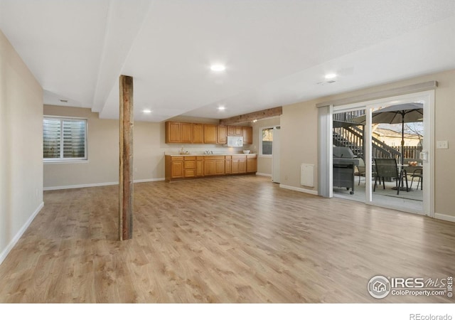 unfurnished living room featuring light hardwood / wood-style flooring