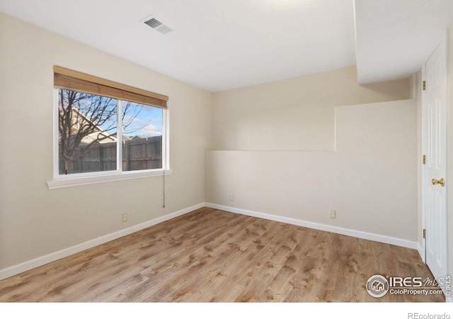 unfurnished room featuring light hardwood / wood-style flooring