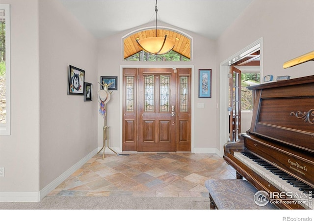 entrance foyer featuring a wealth of natural light and lofted ceiling