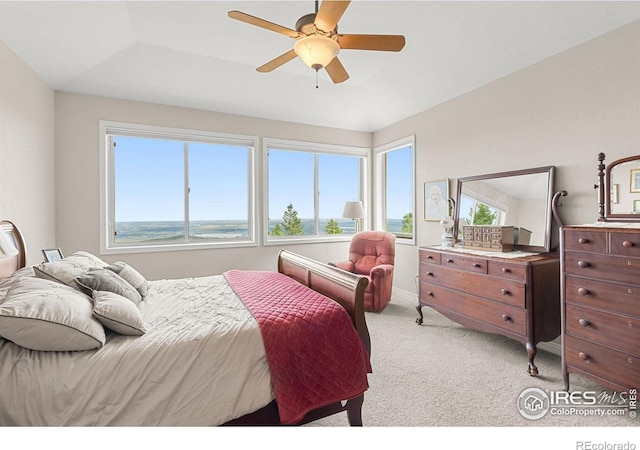 bedroom with ceiling fan and light carpet