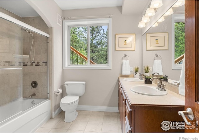 full bathroom featuring toilet, enclosed tub / shower combo, tile patterned flooring, and vanity