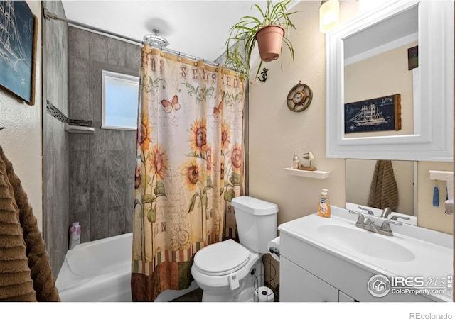 full bathroom featuring vanity, shower / bathtub combination with curtain, and toilet