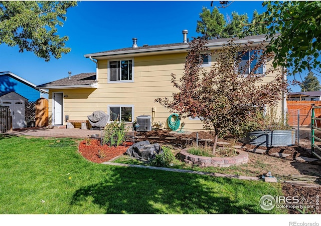 back of house with a yard, a patio area, and central air condition unit