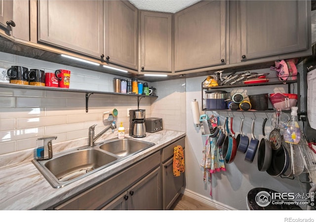 kitchen with tasteful backsplash and sink