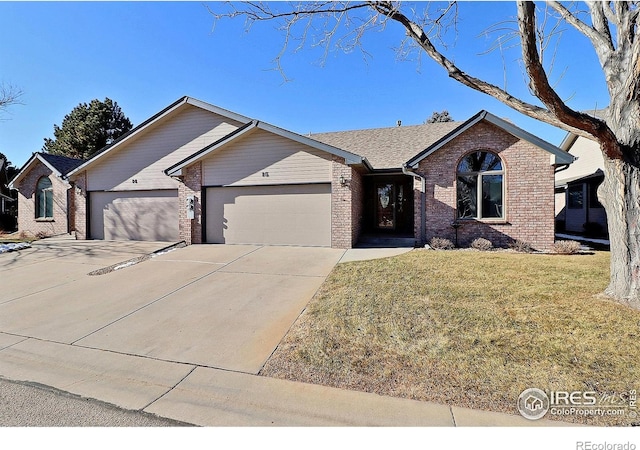 ranch-style home with a front lawn and a garage