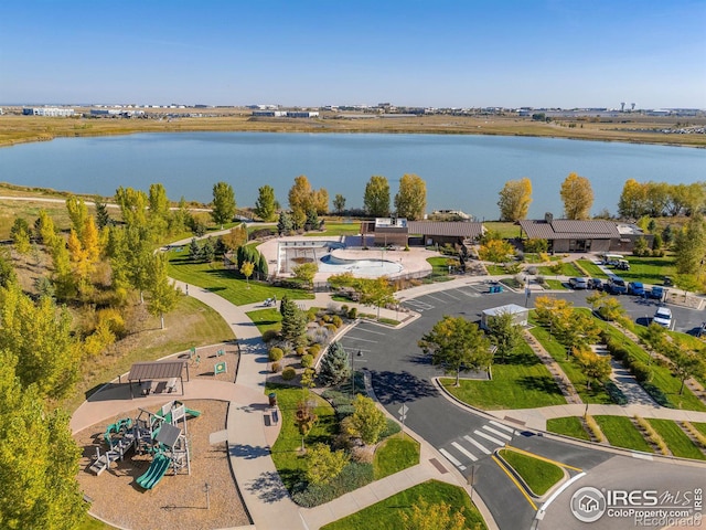 birds eye view of property with a water view