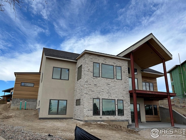 back of property featuring a patio area